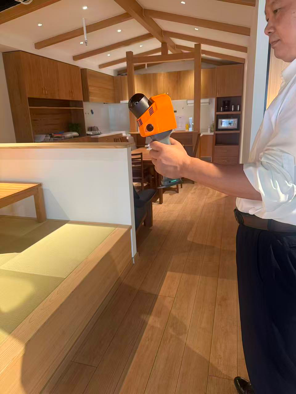 Handheld GS5 scanner being used to capture a furnished interior